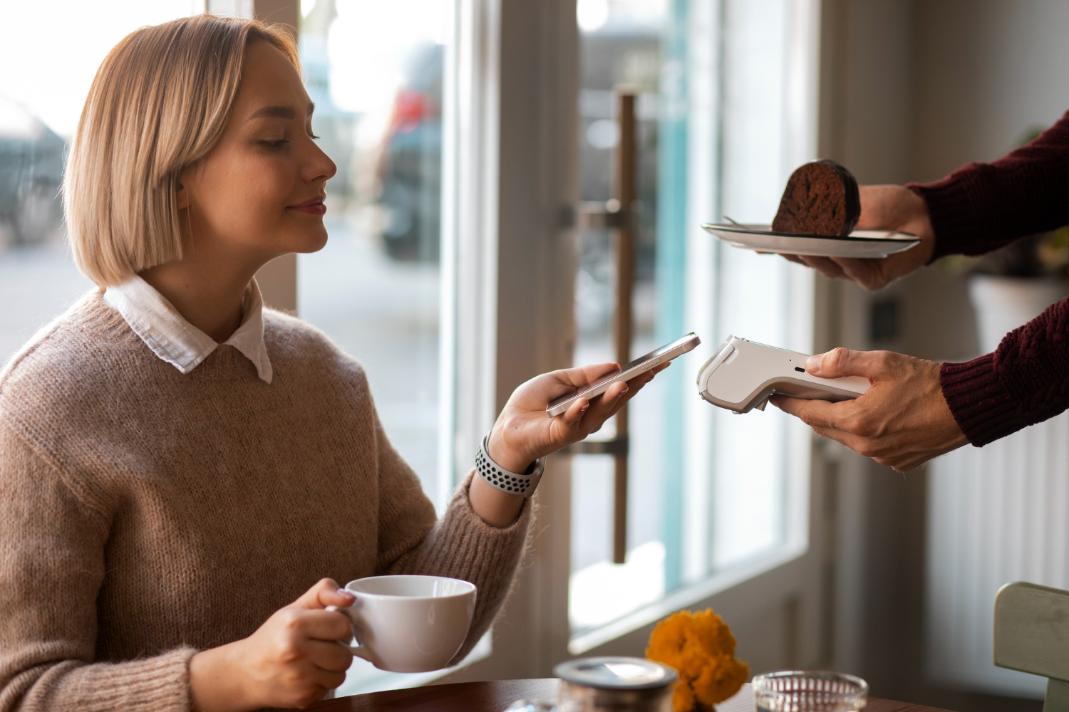 Customer paying while receiving an order.